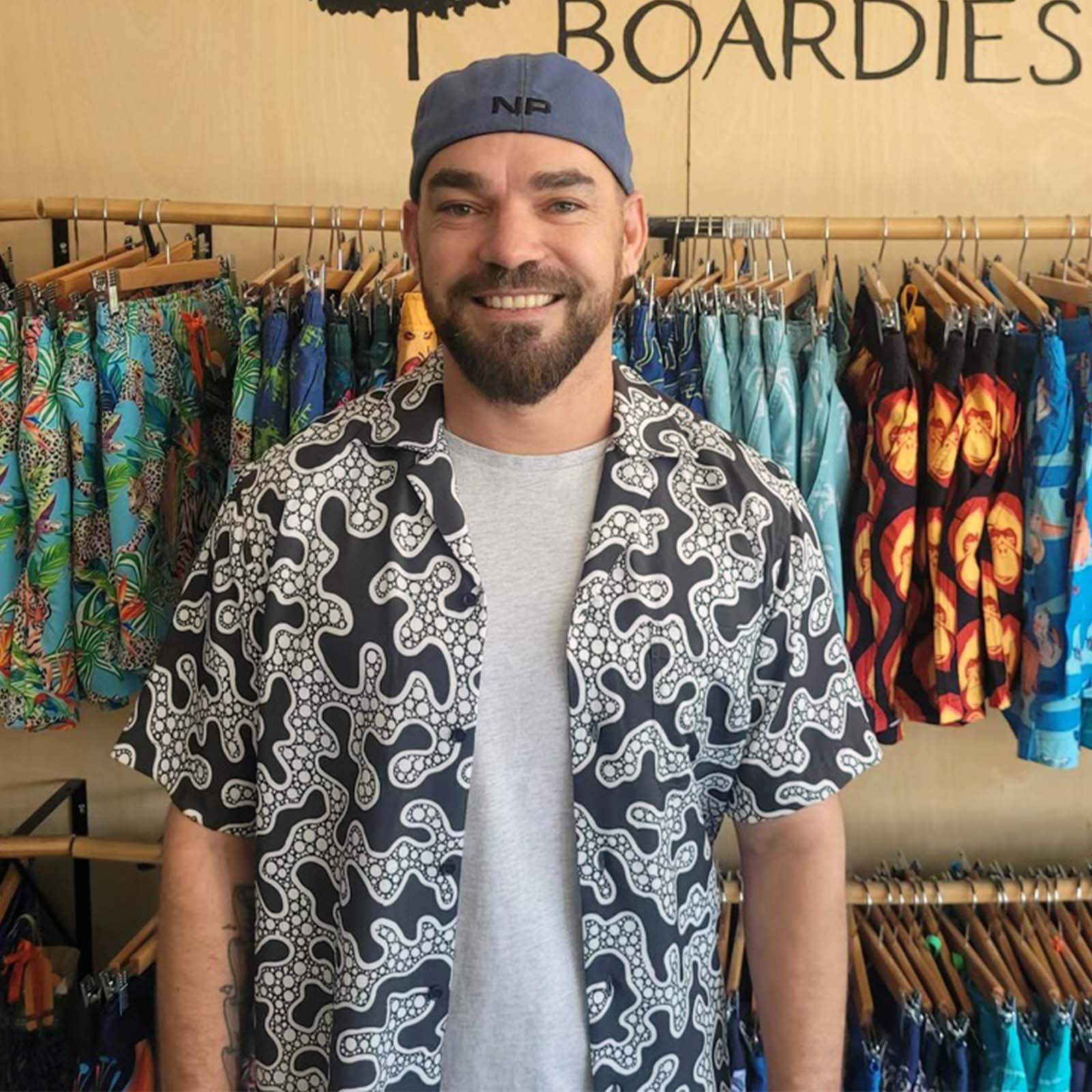 Artist Braden Cotterill wearing Yanu WInja Cubano Shirt, a collaboration between South Boardies and Yungurra Creations