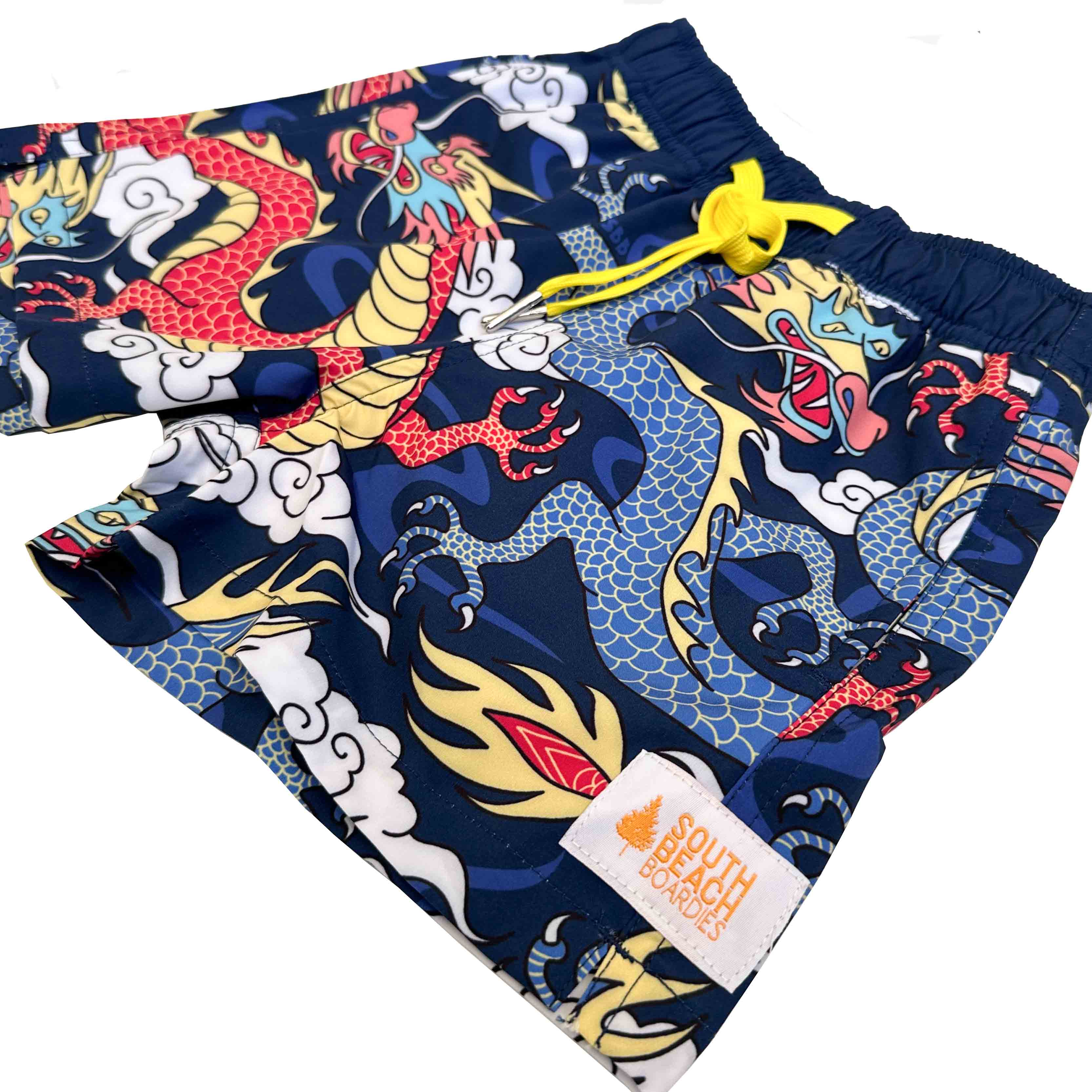 Kids Stretchy Trunks Year of the Dragon made from recycled plastic bottles by South Beach Boardies. side view.