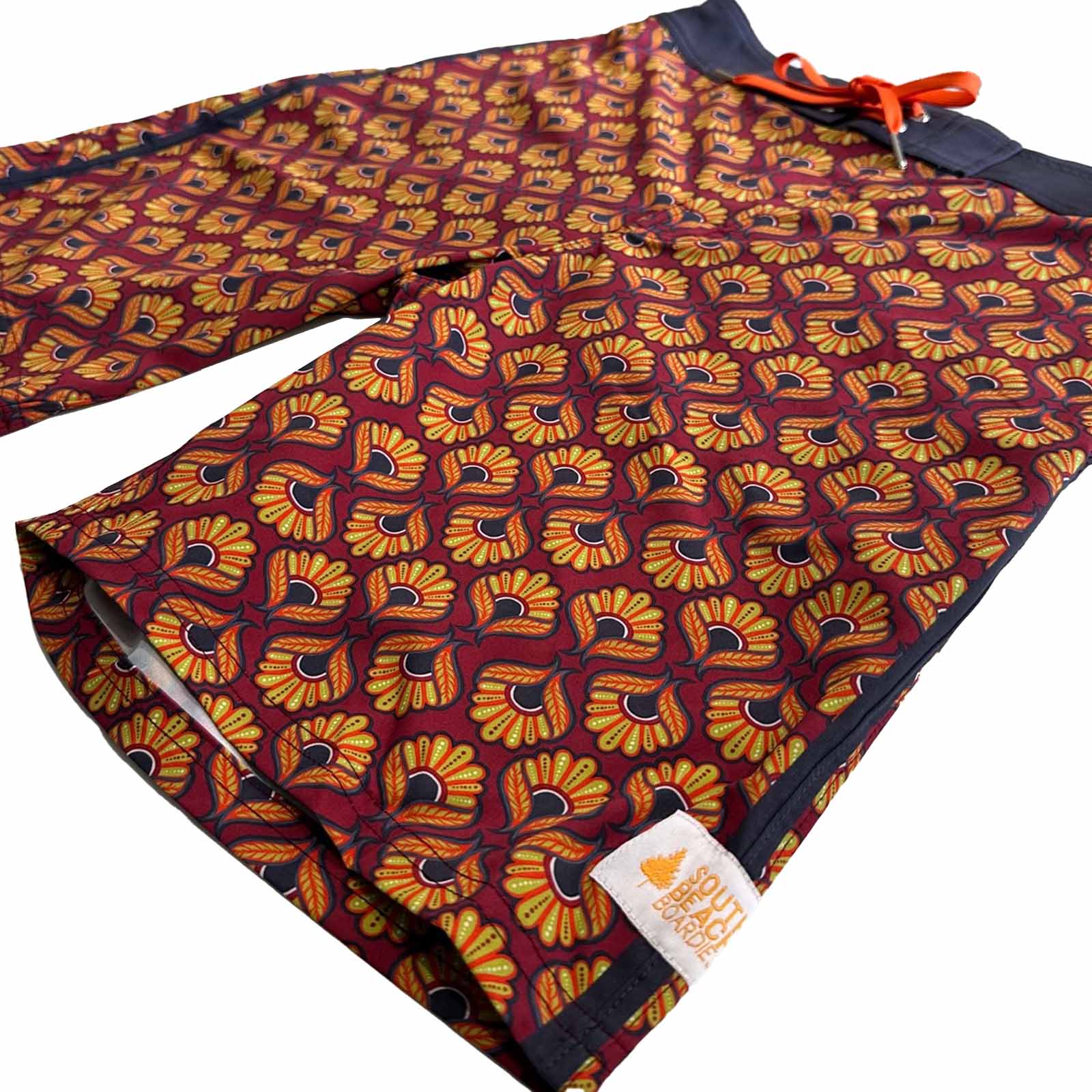 Mens Surfer Boardies from Recycled Plastic Bottles, Peacock print leg close up