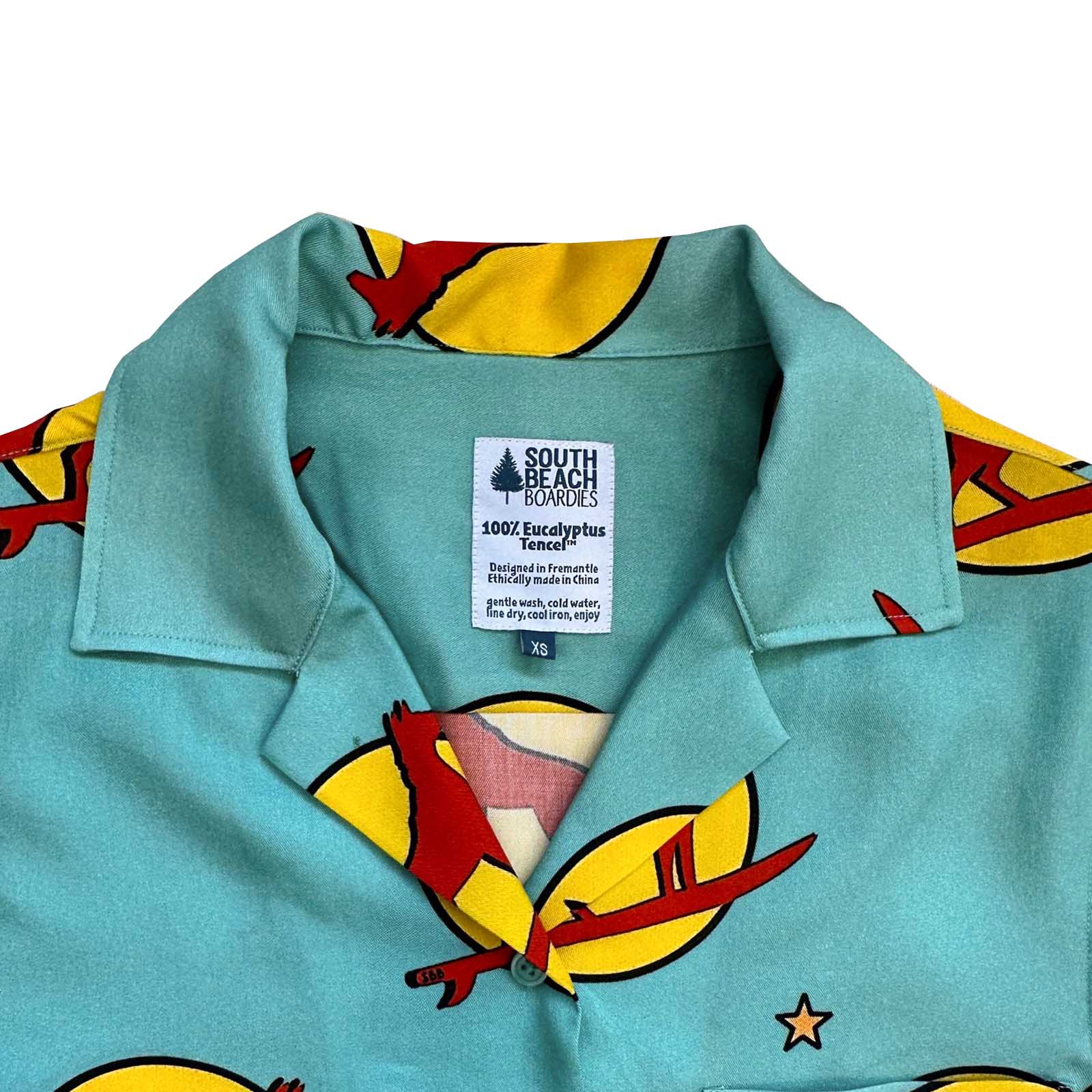 South Beach Boardies Women's Eucalyptus Tencel Cubano shirt in Sunset Dingo print, close up of collar.