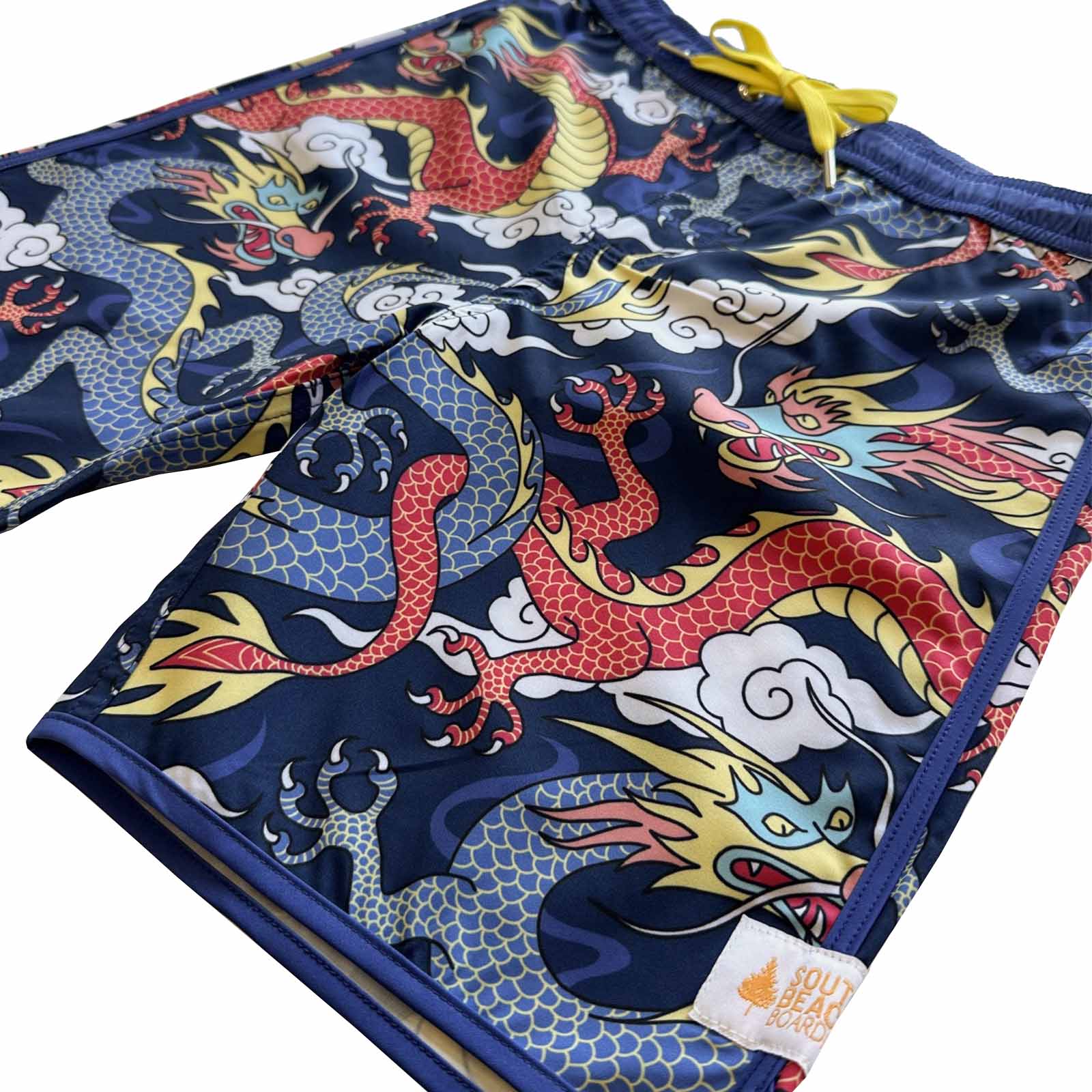 South Beach Boardies Kids Piping Board Shorts in Year of the Dragon print made from recycled plastic bottles, side view