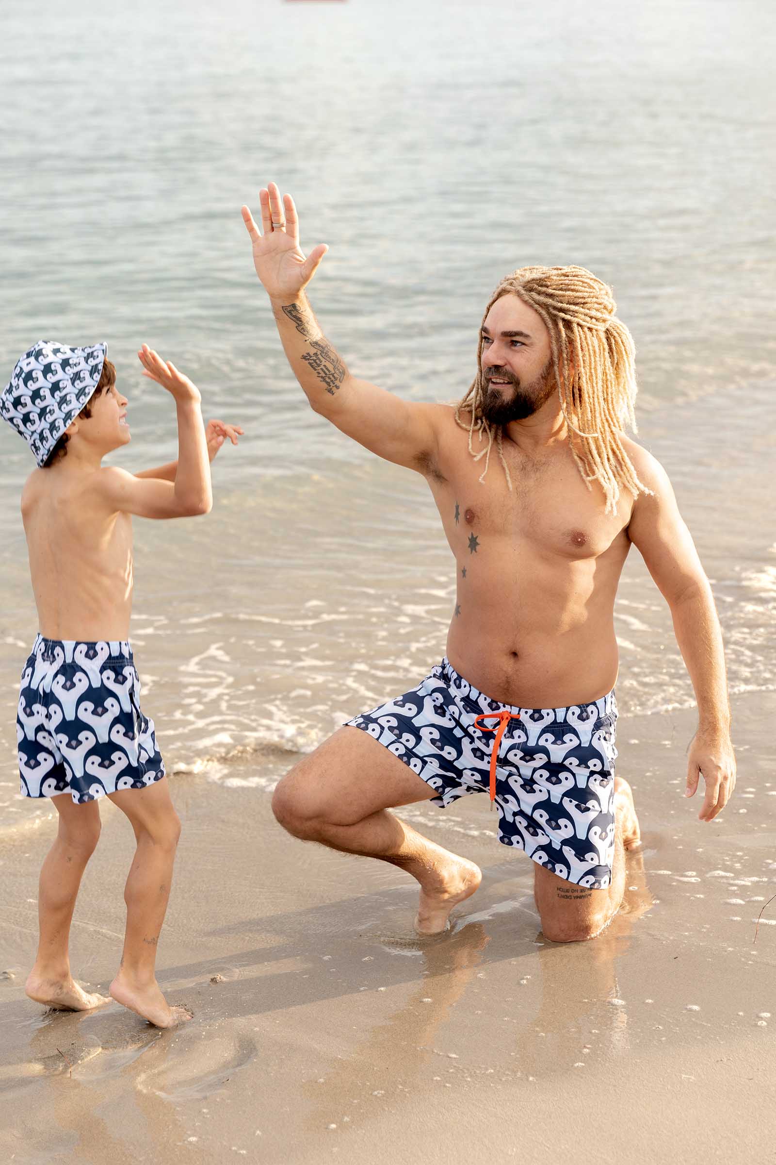 South Beach Boardies Matching Penguin Print, Men's and Kids Stretchy Trunks, Reversible Bucket Hat