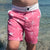 Boy wearing South Beach Boardies Kids Going Out Boardies recycled plastic I Love Dragonflies front view.