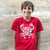 Boy wearing South Beach Boardies red Ocean Plastics Make me Crabby t-shirt