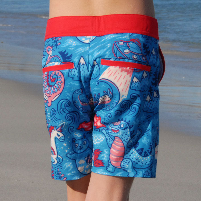 Girl wearing SBB Godzilla & Gang Going Out Boardies back view