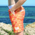 Boy wearing SBB Kids Going Out Boardies recycled Orange Crush side pocket