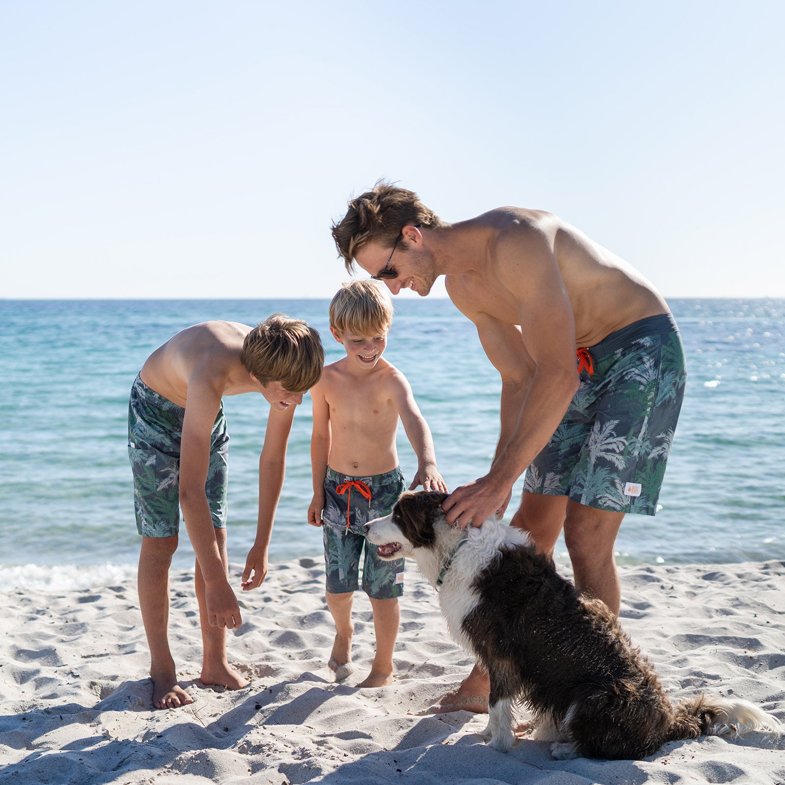 SOUTH BEACH BOARDIES RECYCLED ECO FRIENDLY KIDS LONG BOARD SHORTS IN PALM SPRINGS, WITH MATCHING MENS VERSION AND DOG