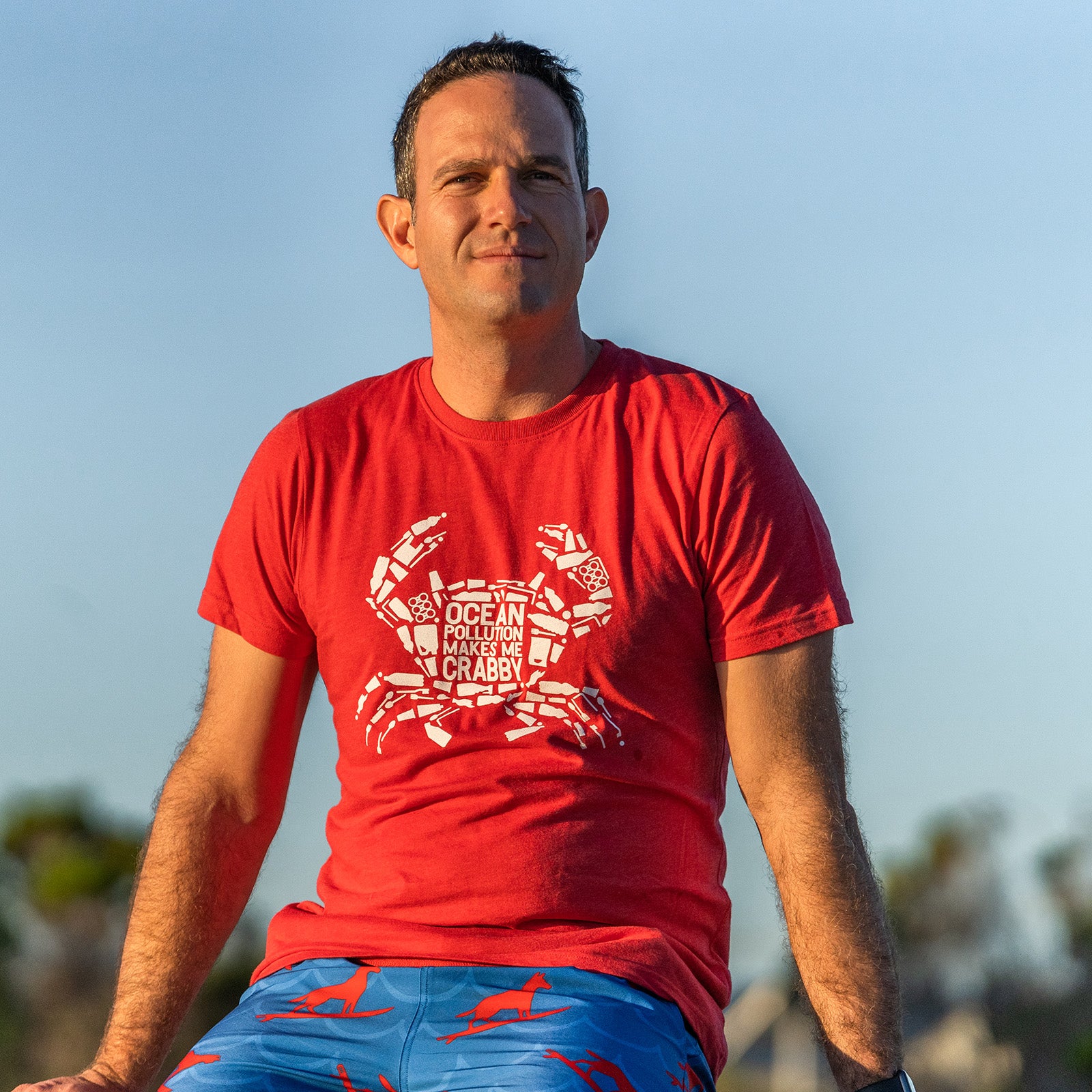 South Beach Boardies eco-friendly Fairwear 100% recycled men's t-shirt- Red - Ocean Pollution Makes Me Crabby, on man