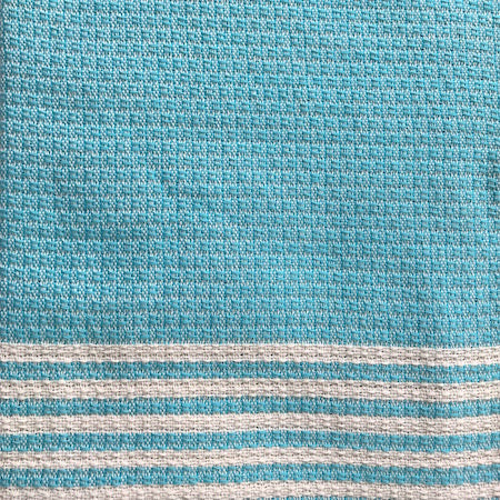 Azure authentic Turkish Towel features a pale turquoise and cream traditional weave across the main body of the towel, with alternating thin turquoise and cream stripes at each end