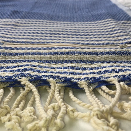 Deep Sea turkish towel has a discreet pocket, so it's perfect as a beach towel 