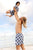 Kids Recycled Rashie in Penguin Parade Print from Recycled Plastic Bottles, made by South Beach Boardies, front, Boy being held up by Dad in matching Penguin boardies