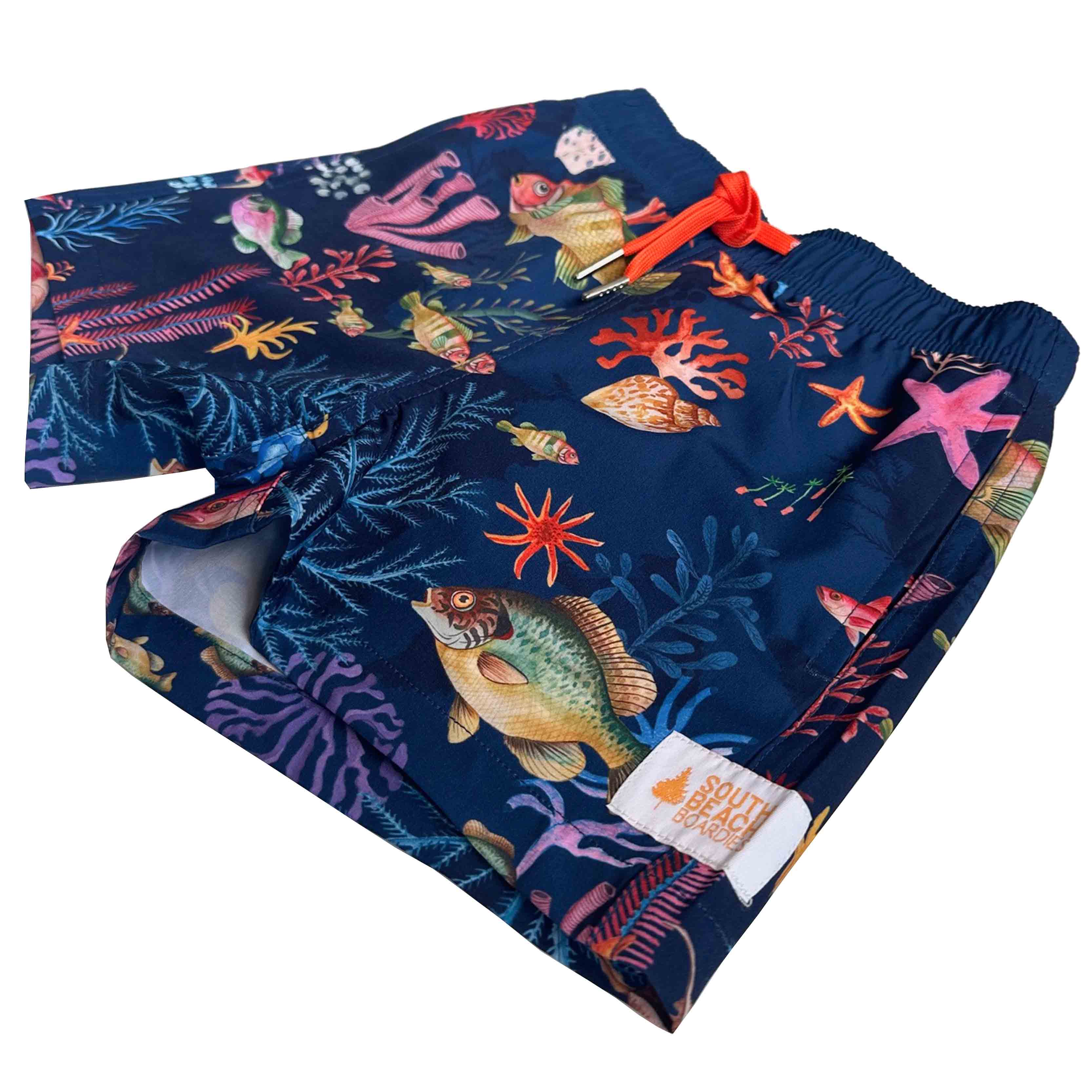 Kids Stretchy Trunks Underwater, made from recycled plastic bottles by South Beach Boardies. side view