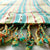 This authentic, ethically made turkish towel has stylish tassels and a handy hidden pocket