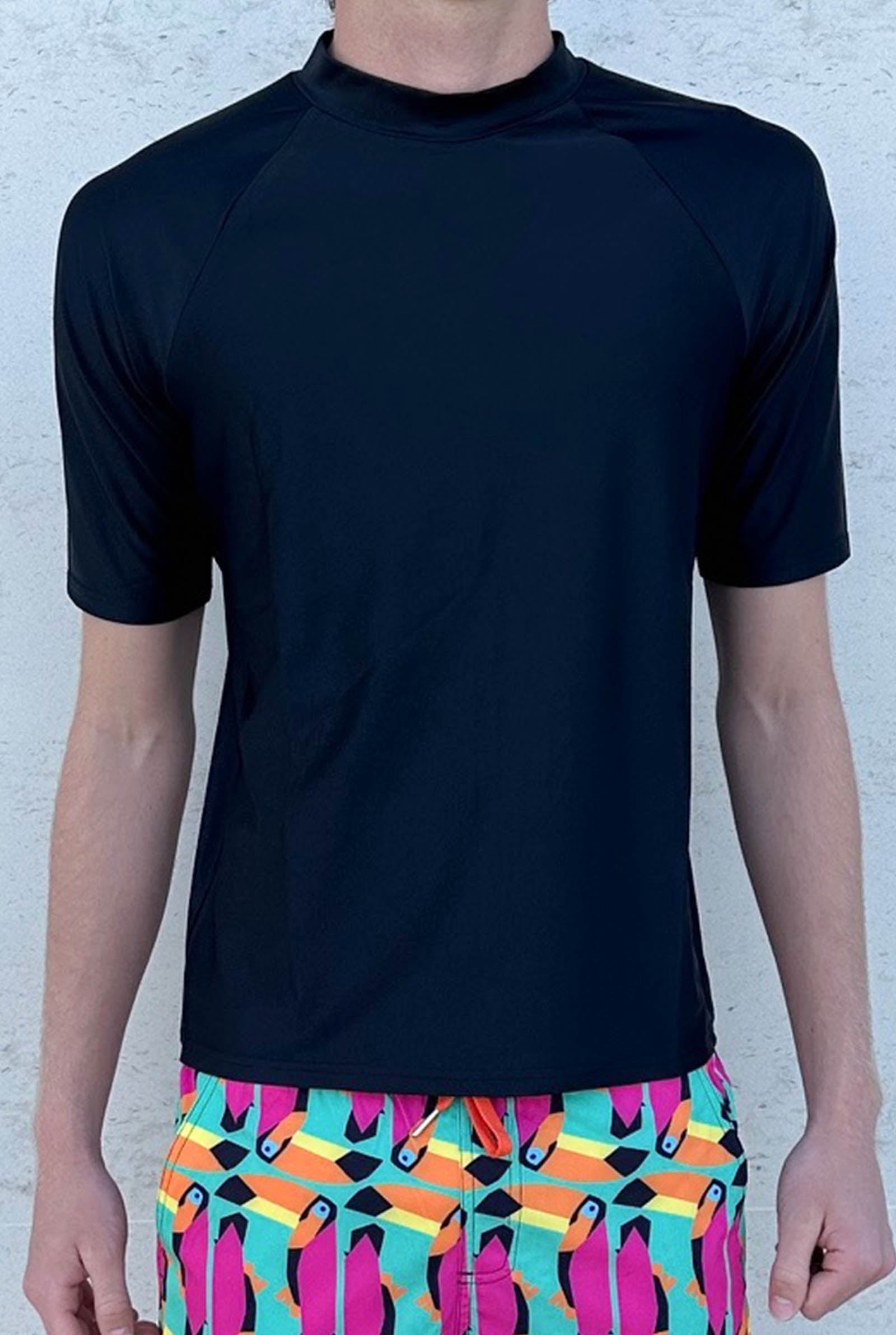 South Beach Boardies Men's Recycled Rashie UPF50+ Black front, modelled by tall male with coloured Toucan Men;s Stretchy Trunks