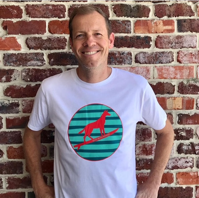 Tim wears  Organic Cotton Surfing Dingo tshirt exclusive to South Beach Boardies, Better for the Planet Beachwear