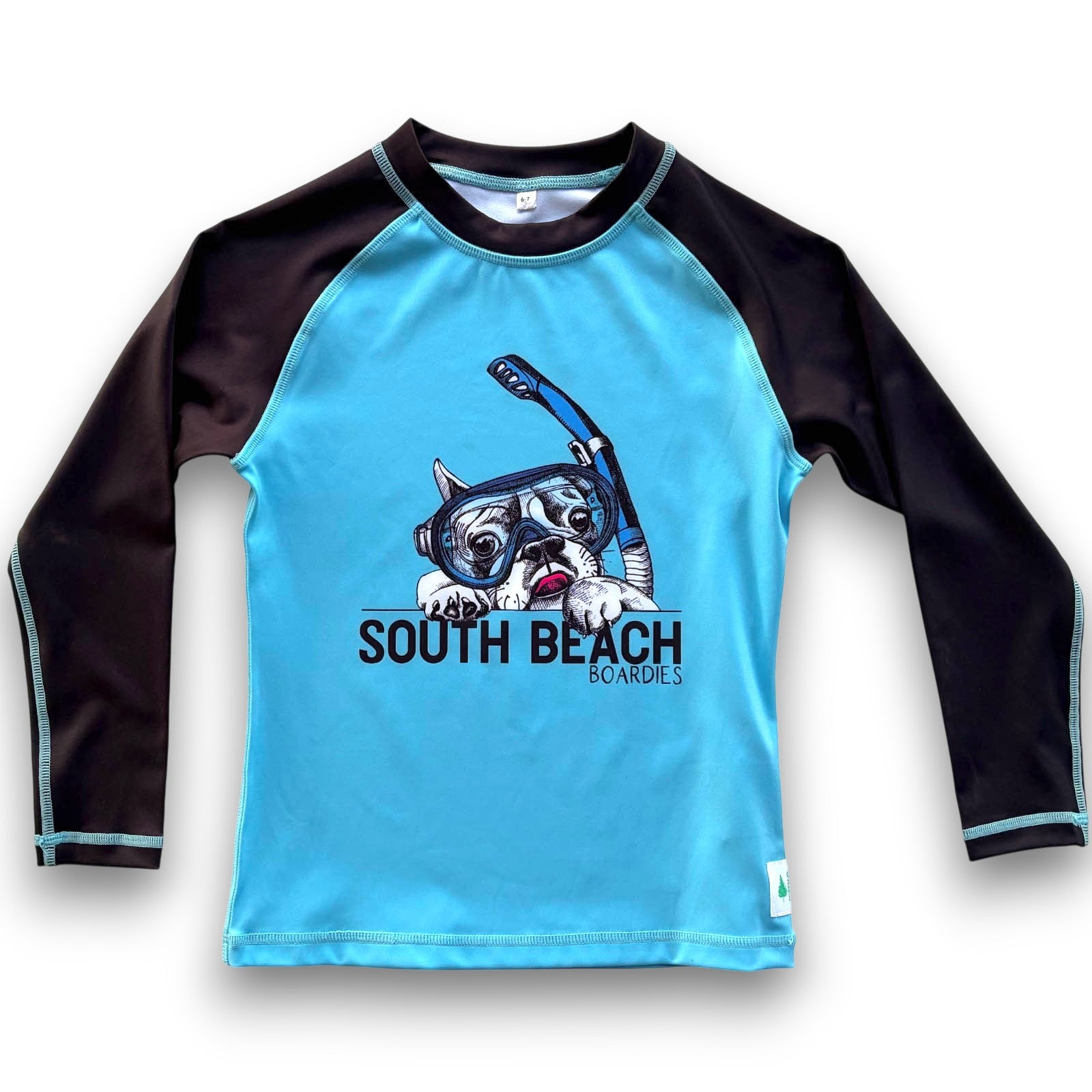 South Beach Boardies Kids Long-Sleeved UPF50 Recycled Rashie made from recycled plastic bottles, featured snorkelling dog image on a blue background with long black sleeves, front view