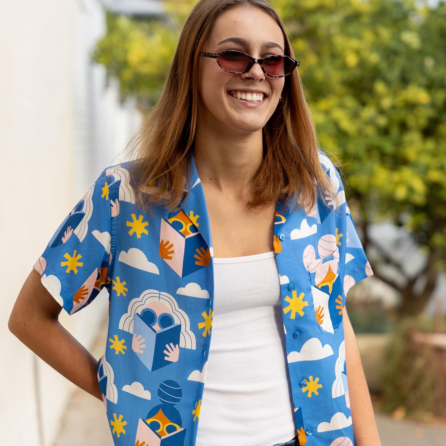 Woman wearing a colorful patterned shirt on a Fremantle street. The shirt is a Womens Tencel Cubano Hawaiian style shirt by South Beach Boardies
