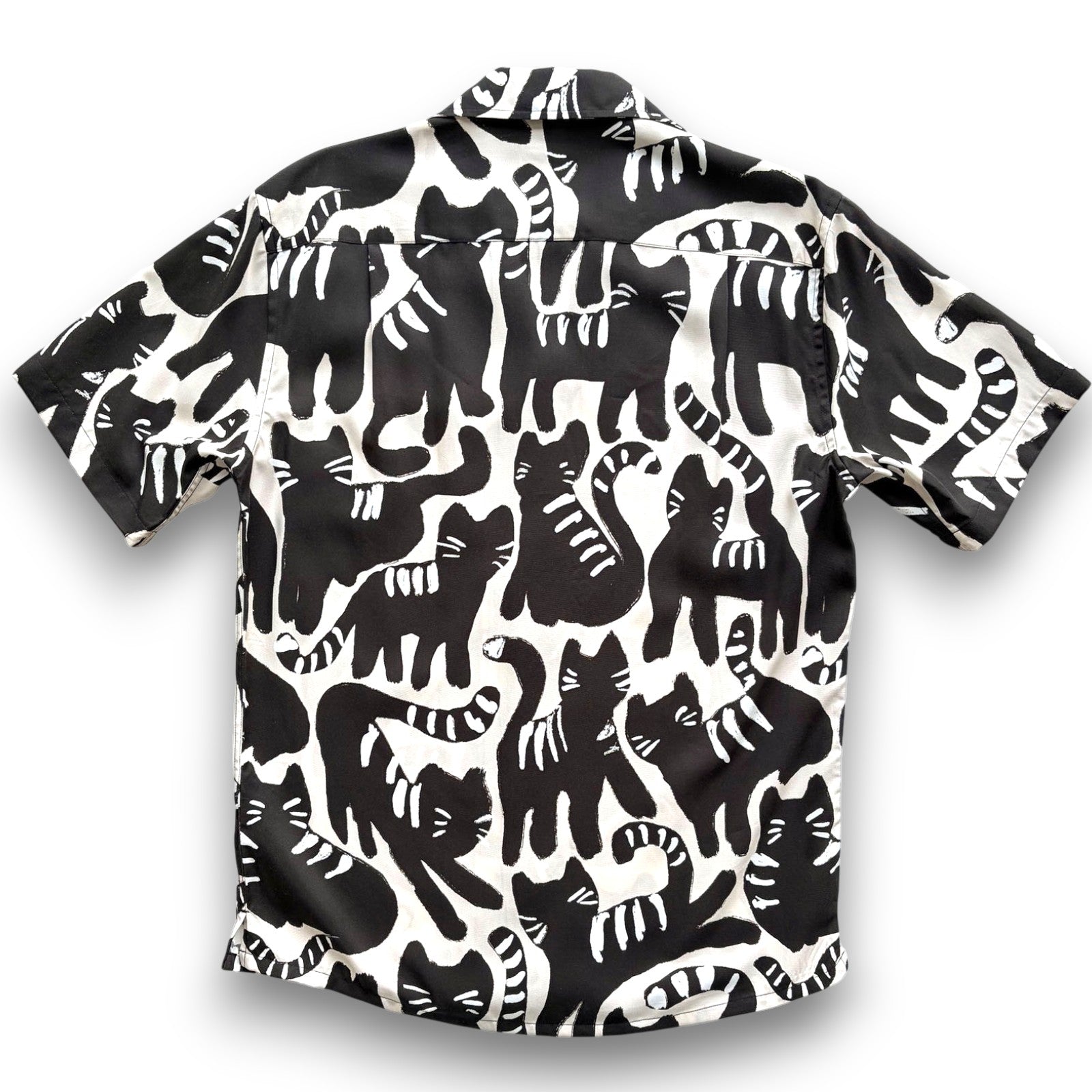 Black and white patterned shirt with cat design on a pale background, South Beach Boardies Men's Cubano Shirt made from Eucalyptus Tencel in Night Cat print, back view