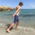 Boy running in South Beach Boardies Kids Long Boardies recycled plastic Sea Dragons side view