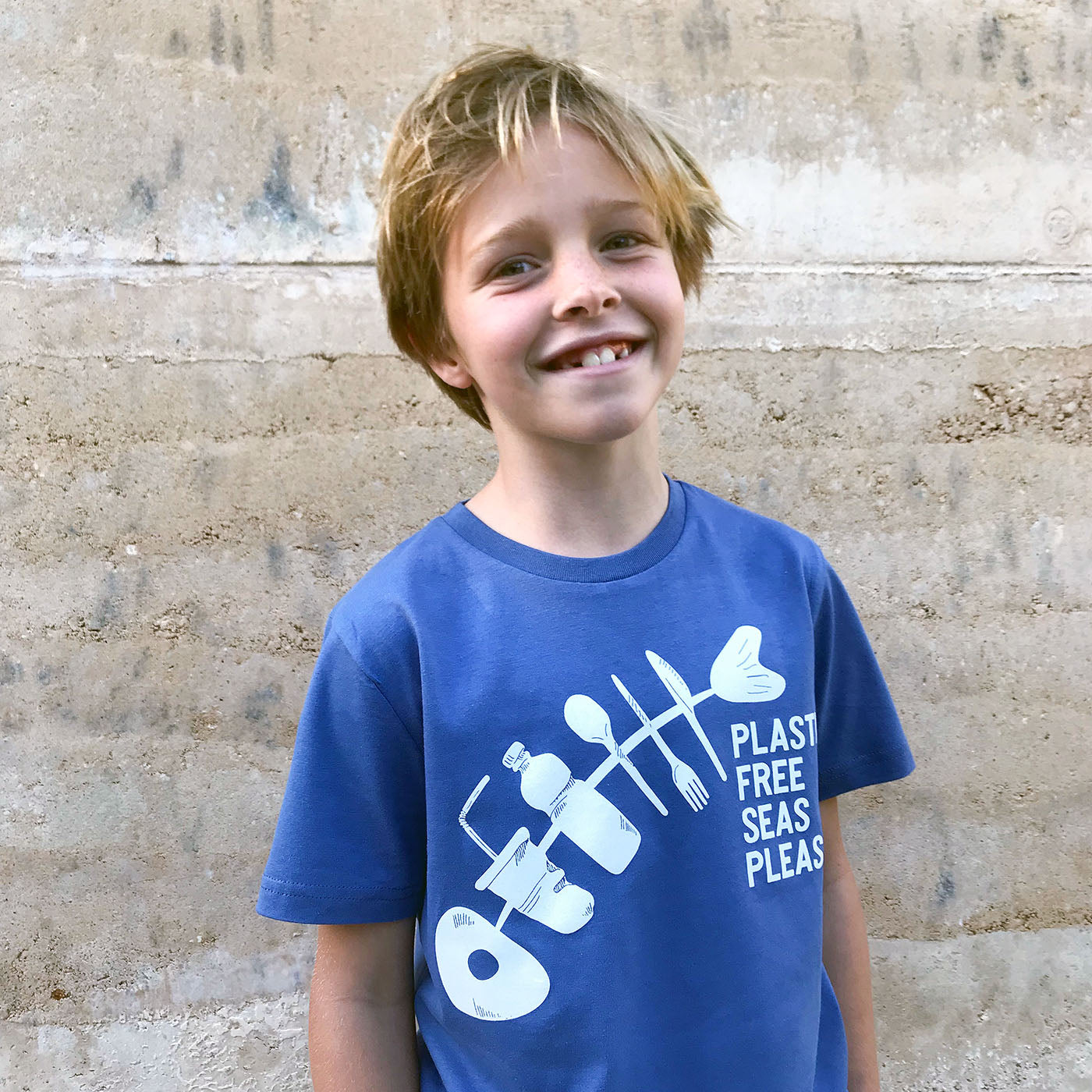 Boy wearing South Beach Boardies Fish T-shirt Plastic Free Seas Please