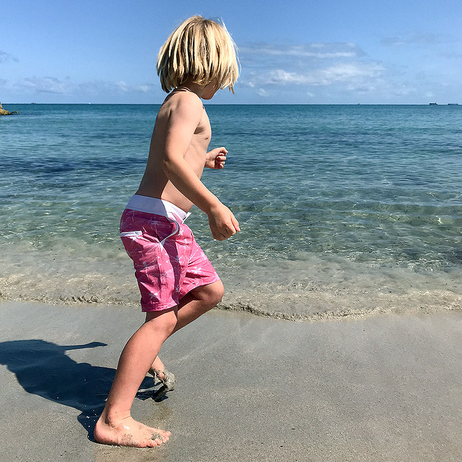 Boy wearing South Beach Boardies Kids Going Out Boardies recycled plastic I Love Dragonflies running side view