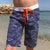 Boy wearing South Beach Boardies Kids Long Boardies recycled plastic Sea Dragons front view