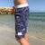 Boy wearing South Beach Boardies Kids Long Boardies recycled plastic Sea Dragons side view