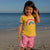 Girl wearing South Beach Boardies Kids Going Out Boardies recycled plastic I Love Dragonflies