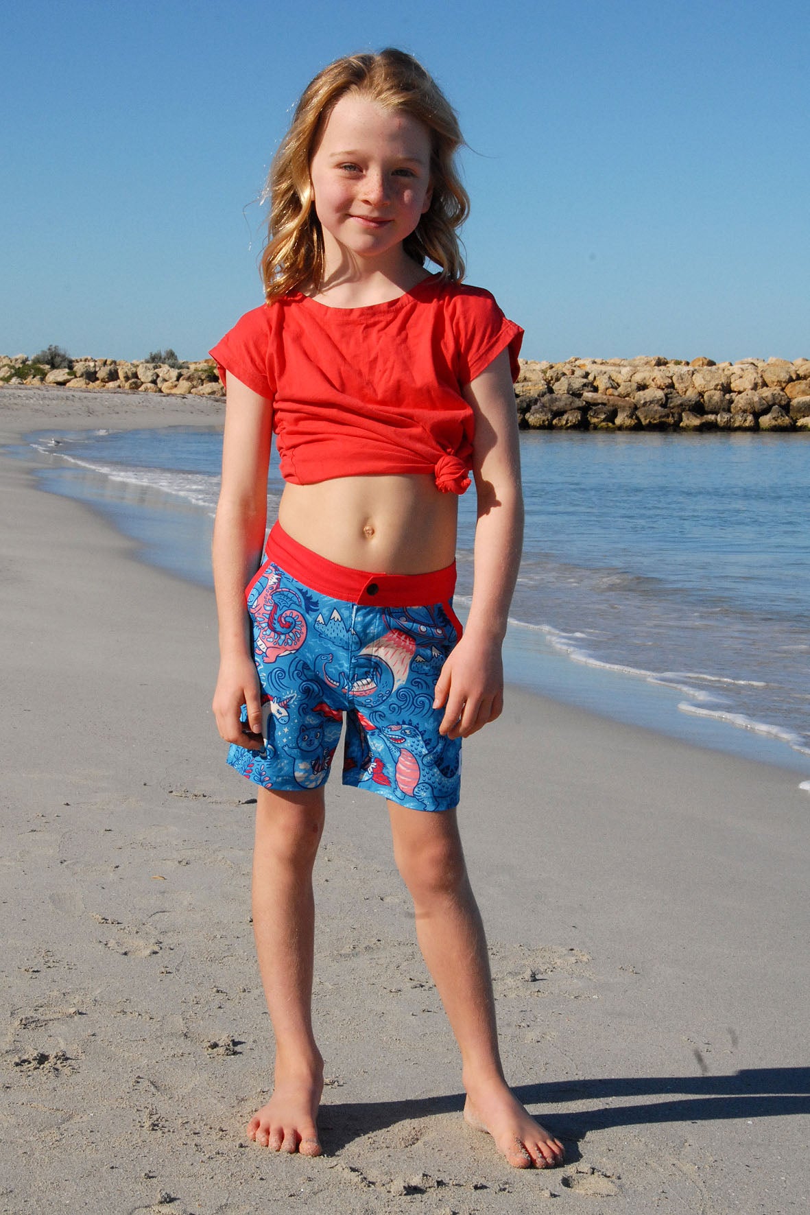 Girl wearing SBB Godzilla & Gang Going Out Boardies full view