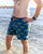 South Beach Boardies Men's Stretchy Swimming Trunks made from recycled plastic bottles, limited edition Leafy Seadragons print, worn at South Beach Dog Beach by man, ws.jpg